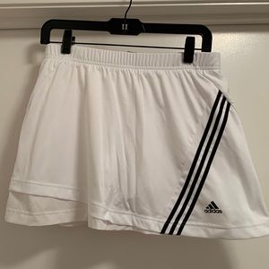 Adidas white tennis skirt/skort with undershorts and tennis ball pockets.